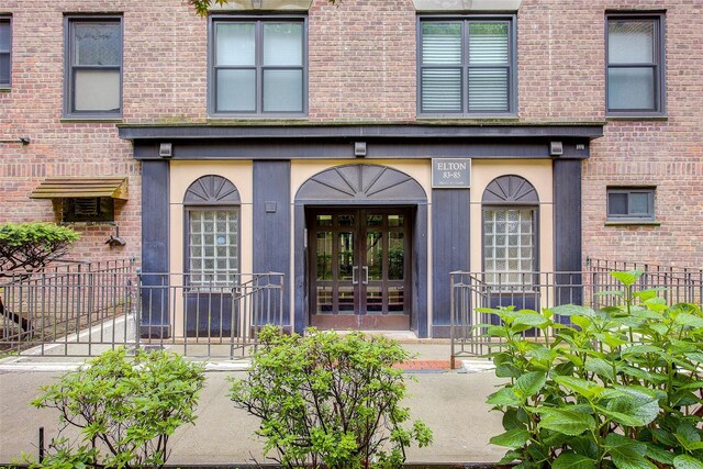 83-85 Woodhaven Blvd Unit 6F, Woodhaven, NY 11421 - view of exterior entry featuring french doors and brick siding