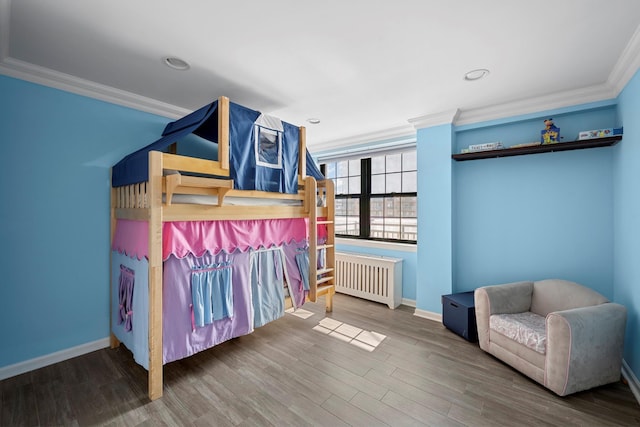 26 W Broadway Unit 405, Long Beach, NY 11561 - bedroom with radiator heating unit, crown molding, wood finished floors, and recessed lighting