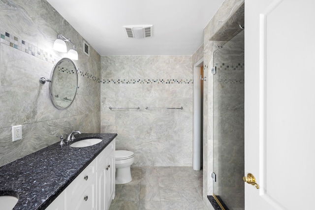 26 W Broadway Unit 405, Long Beach, NY 11561 - bathroom featuring tile walls, double vanity, and a stall shower