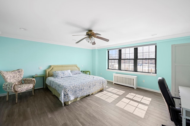 26 W Broadway Unit 405, Long Beach, NY 11561 - bedroom featuring radiator, wood finished floors, a ceiling fan, ornamental molding, and an office area