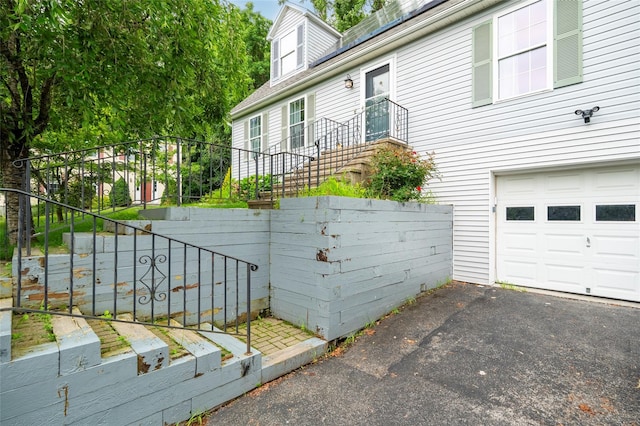 18 Jenkins Ct, Ossining, NY 10562 - view of property exterior with a garage and stairs