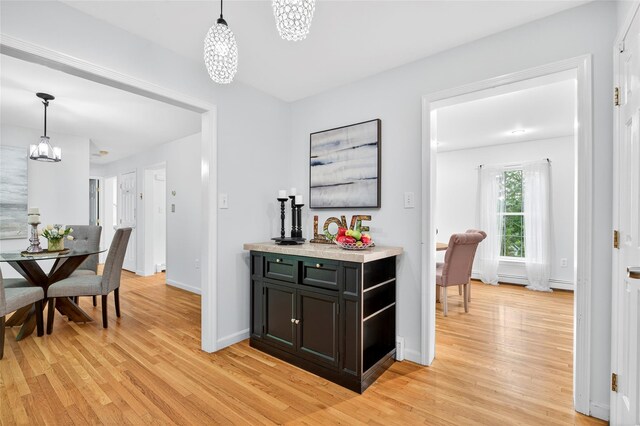 18 Jenkins Ct, Ossining, NY 10562 - dining area with a chandelier and light wood finished floors