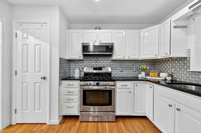 18 Jenkins Ct, Ossining, NY 10562 - kitchen featuring appliances with stainless steel finishes, white cabinetry, and dark countertops