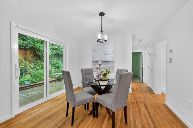 18 Jenkins Ct, Ossining, NY 10562 - dining room featuring light wood-style flooring and a chandelier