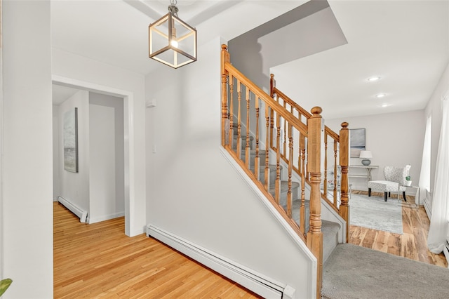 18 Jenkins Ct, Ossining, NY 10562 - staircase with a baseboard radiator, wood finished floors, and recessed lighting