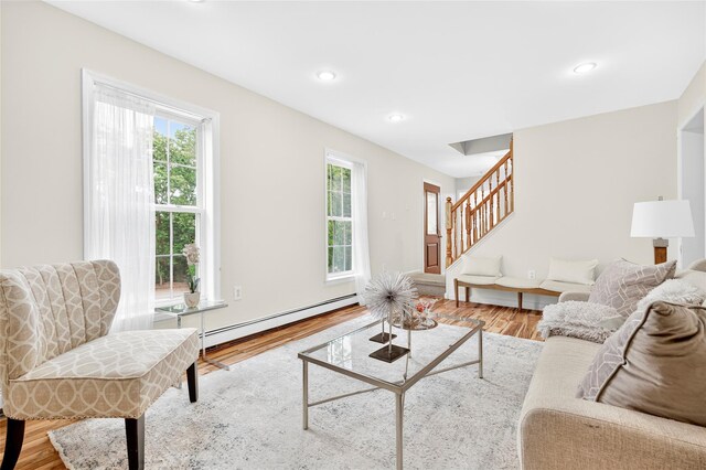 18 Jenkins Ct, Ossining, NY 10562 - living room with a baseboard radiator, wood finished floors, stairway, and recessed lighting