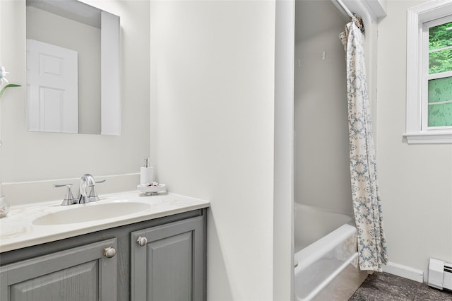 18 Jenkins Ct, Ossining, NY 10562 - full bathroom featuring a baseboard heating unit, vanity, and shower / bath combination with curtain
