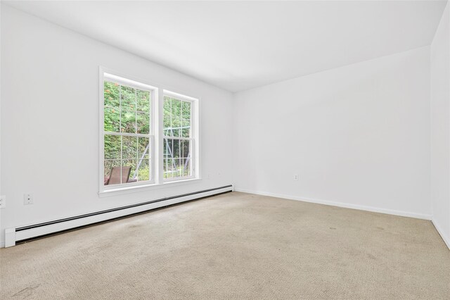 18 Jenkins Ct, Ossining, NY 10562 - carpeted empty room with a baseboard radiator and baseboards