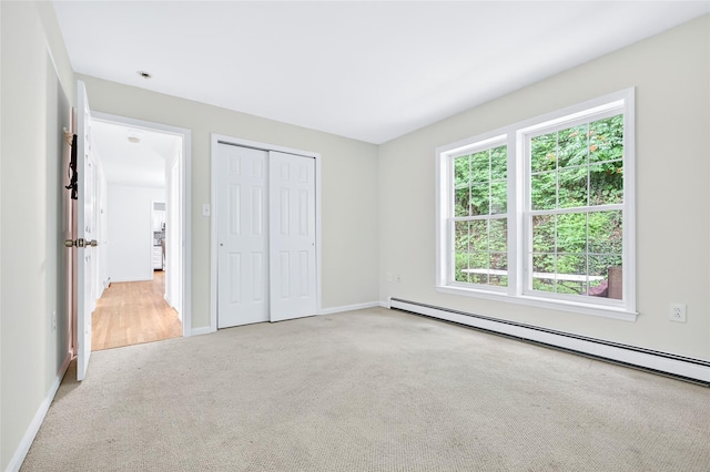 18 Jenkins Ct, Ossining, NY 10562 - unfurnished bedroom featuring a baseboard radiator, carpet floors, and a closet