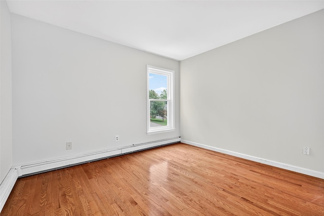 18 Jenkins Ct, Ossining, NY 10562 - unfurnished room with wood finished floors and a baseboard radiator