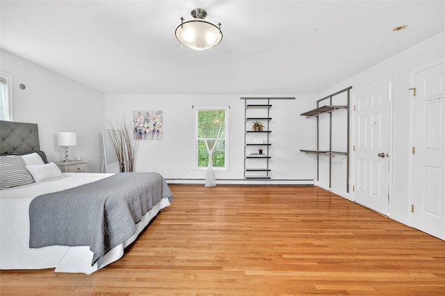 18 Jenkins Ct, Ossining, NY 10562 - bedroom with light wood finished floors and a baseboard heating unit