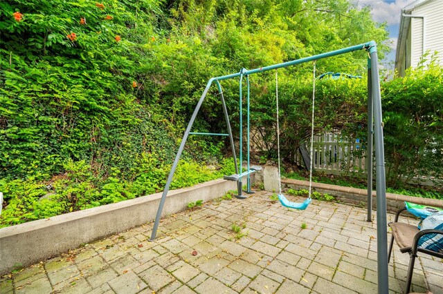 18 Jenkins Ct, Ossining, NY 10562 - view of playground with a patio area