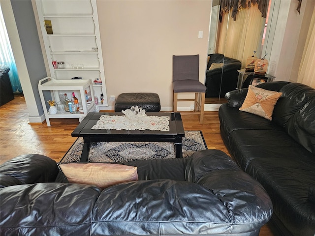 1430 Gipson St, Far Rockaway, NY 11691 - living room featuring wood finished floors and baseboards