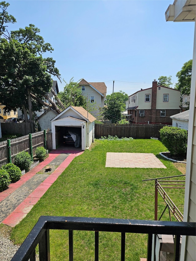 1430 Gipson St, Far Rockaway, NY 11691 - fenced yard with a detached garage, an outbuilding, driveway, and a residential view