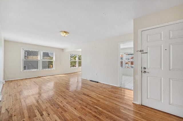 214-04 18th Ave, Bayside, NY 11360 - spare room with wood finished floors and baseboards