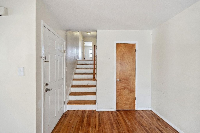 214-04 18th Ave, Bayside, NY 11360 - stairs featuring wood finished floors and baseboards