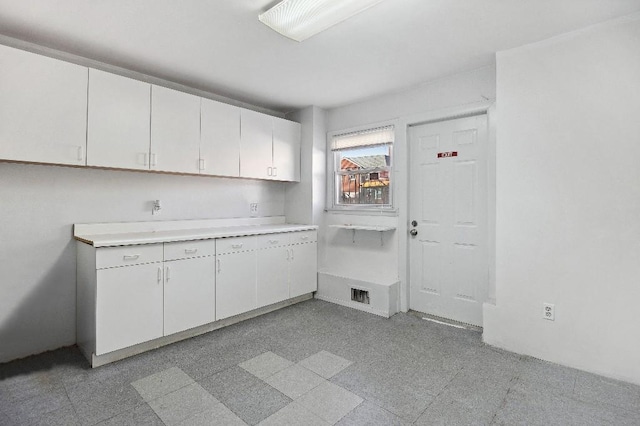 214-04 18th Ave, Bayside, NY 11360 - kitchen with white cabinets and light countertops