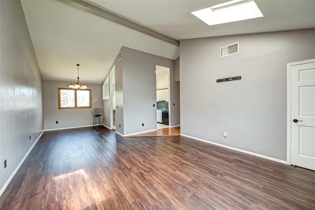 21 Clifford Blvd, Hauppauge, NY 11788 - unfurnished living room featuring a skylight, a chandelier, and dark wood-style floors