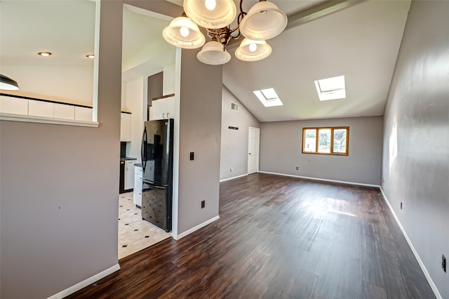 21 Clifford Blvd, Hauppauge, NY 11788 - unfurnished living room with a skylight, wood finished floors, a chandelier, and high vaulted ceiling