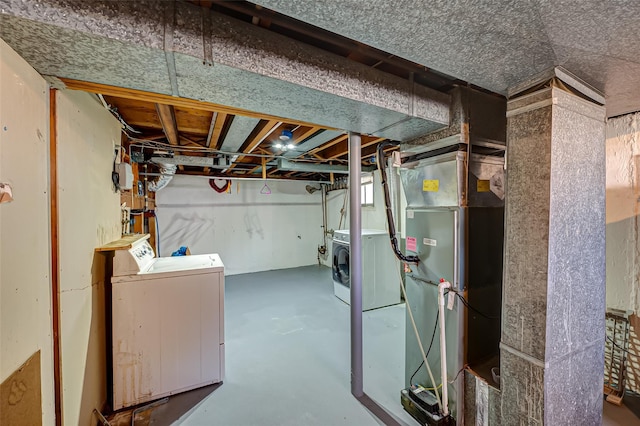 21 Clifford Blvd, Hauppauge, NY 11788 - unfinished below grade area featuring independent washer and dryer and heating unit