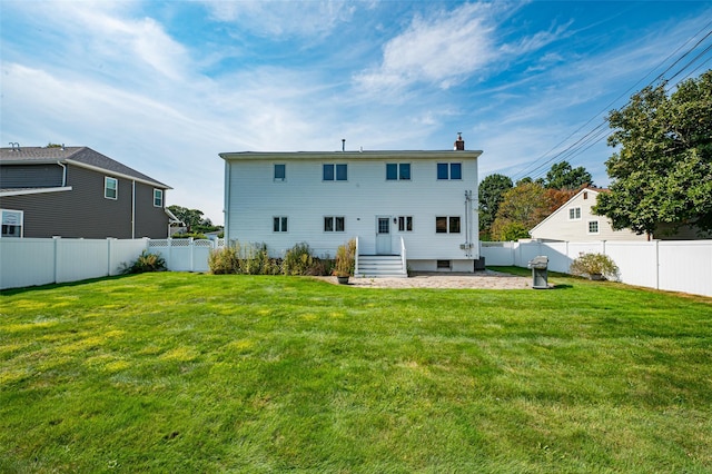 21 Clifford Blvd, Hauppauge, NY 11788 - back of house with a fenced backyard and a chimney