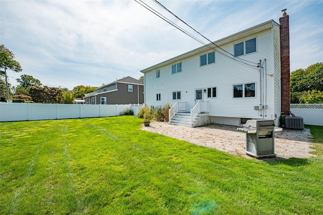 21 Clifford Blvd, Hauppauge, NY 11788 - back of house featuring a chimney, a patio, and a fenced backyard