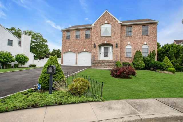 15 Howard Ct, Plainview, NY 11803 - view of front of home with brick siding, asphalt driveway, and a garage
