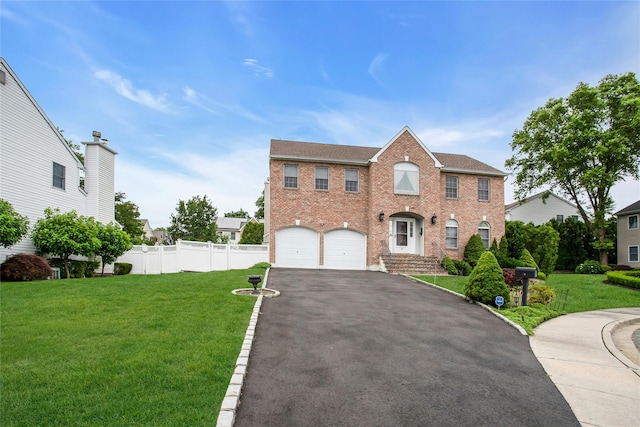15 Howard Ct, Plainview, NY 11803 - colonial home featuring driveway, brick siding, an attached garage, and roof with shingles