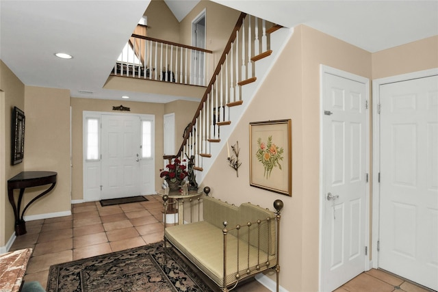 15 Howard Ct, Plainview, NY 11803 - foyer featuring light tile patterned floors, stairs, and recessed lighting