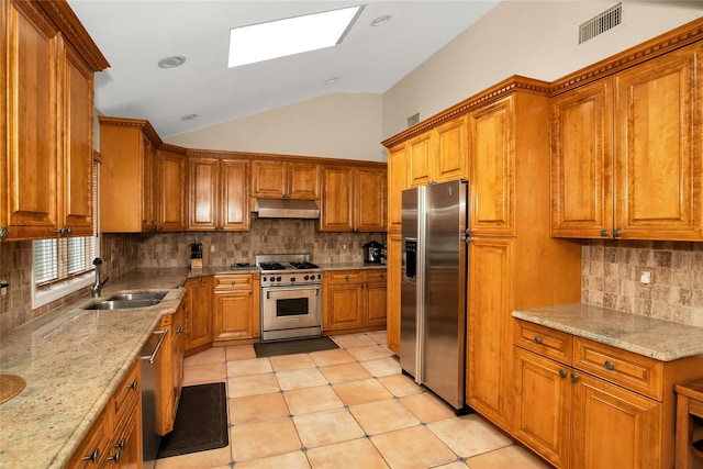 15 Howard Ct, Plainview, NY 11803 - kitchen featuring appliances with stainless steel finishes, under cabinet range hood, brown cabinets, tasteful backsplash, and lofted ceiling