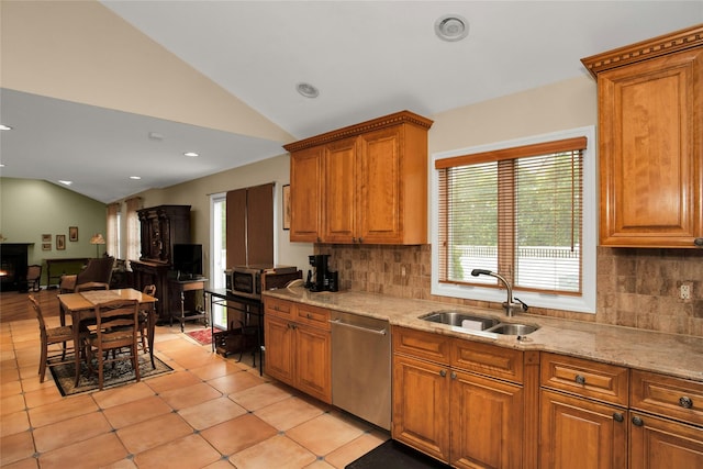 15 Howard Ct, Plainview, NY 11803 - kitchen featuring appliances with stainless steel finishes, vaulted ceiling, brown cabinetry, backsplash, and light stone counters