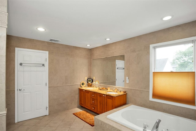 15 Howard Ct, Plainview, NY 11803 - full bath with a jetted tub, tile patterned flooring, double vanity, recessed lighting, and tile walls