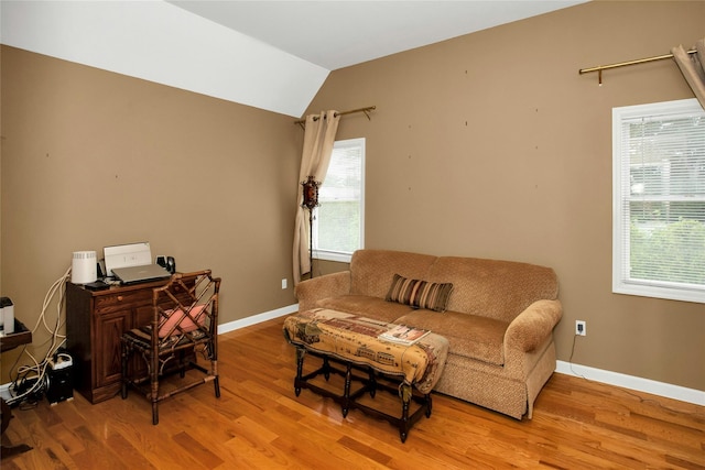 15 Howard Ct, Plainview, NY 11803 - living room with wood finished floors, healthy amount of natural light, vaulted ceiling, and an office area