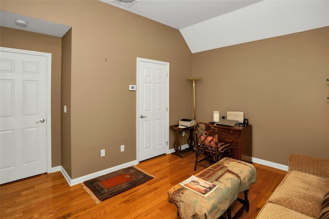 15 Howard Ct, Plainview, NY 11803 - living area featuring wood finished floors, vaulted ceiling, and an office area