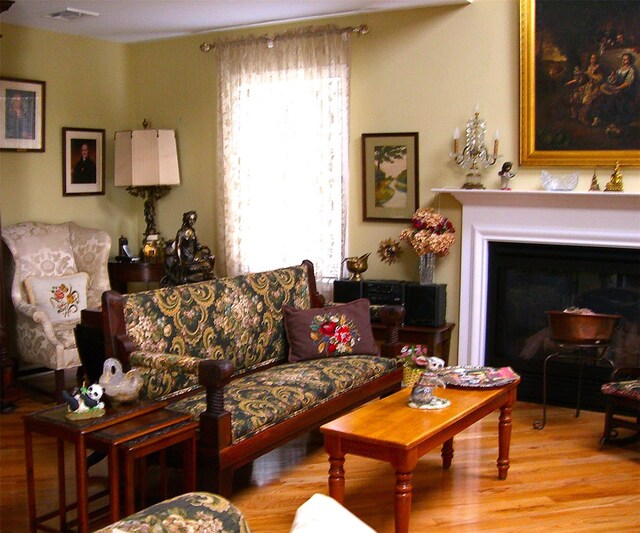 15 Howard Ct, Plainview, NY 11803 - living area featuring wood finished floors and a fireplace