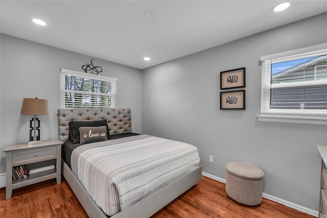 756 Bohemia Pkwy, Sayville, NY 11782 - bedroom featuring multiple windows, wood finished floors, and recessed lighting