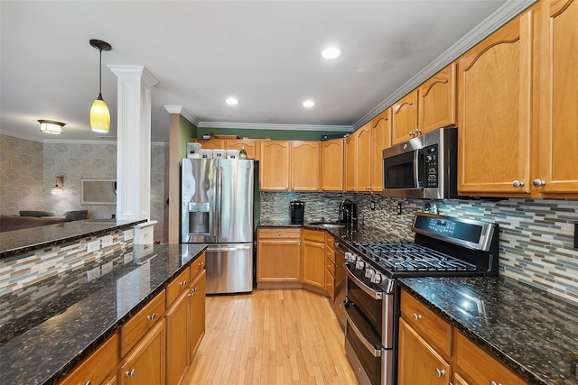 97 Hillcrest Ln, Peekskill, NY 10566 - kitchen with stainless steel appliances, ornamental molding, light wood-style flooring, backsplash, and dark stone countertops