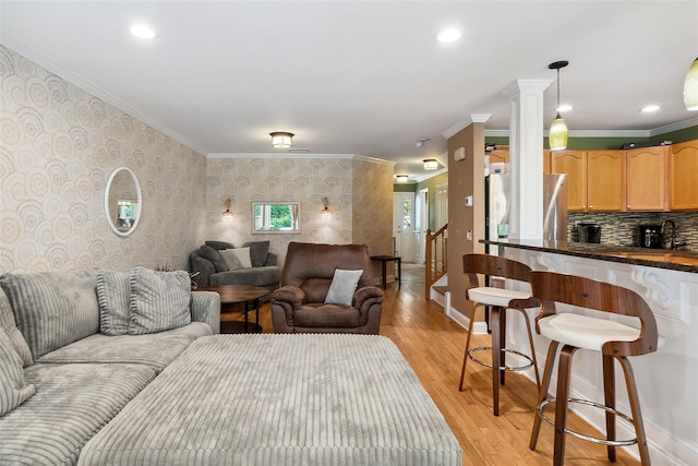 97 Hillcrest Ln, Peekskill, NY 10566 - living area with wallpapered walls, light wood-style flooring, crown molding, recessed lighting, and decorative columns