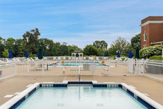 97 Hillcrest Ln, Peekskill, NY 10566 - community pool with a patio area and view of wooded area