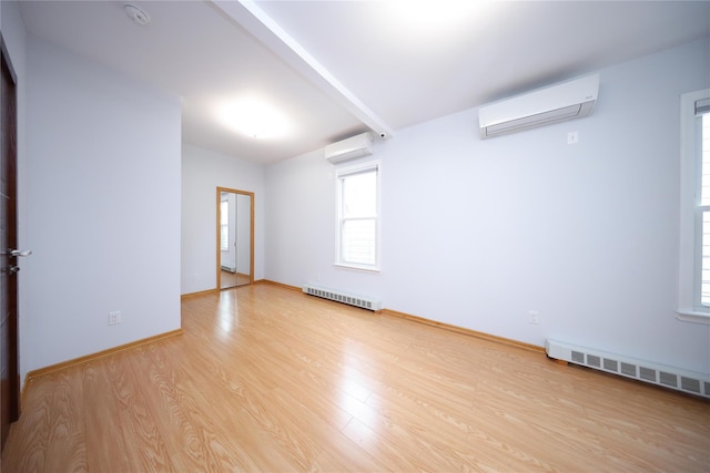 1768 W 5th St, Brooklyn, NY 11223 - unfurnished room with a wall unit AC, wood finished floors, a smoke detector, and baseboard heating