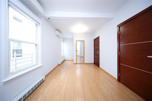 1768 W 5th St, Brooklyn, NY 11223 - hall with a wall unit AC, light wood-style flooring, and baseboard heating