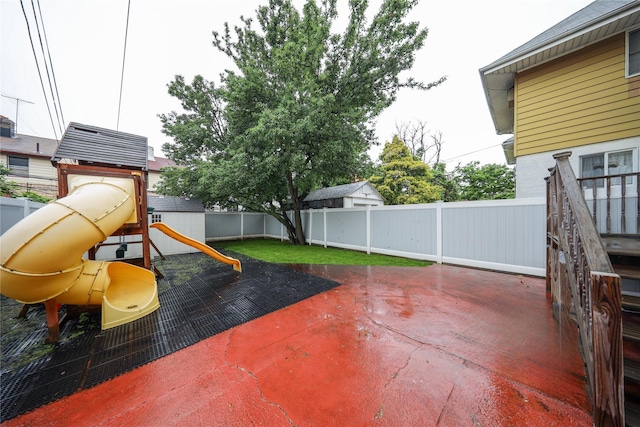 1768 W 5th St, Brooklyn, NY 11223 - fenced backyard featuring a playground and a patio area