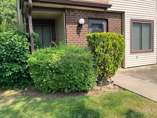 77 Birchwood Rd, Coram, NY 11727 - view of exterior entry with brick siding