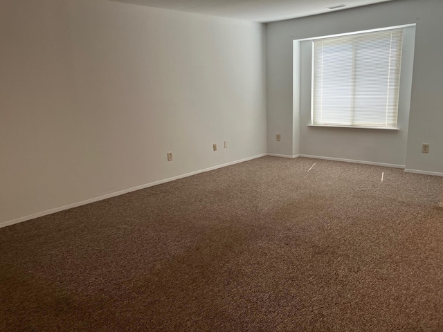77 Birchwood Rd, Coram, NY 11727 - empty room featuring carpet floors and baseboards