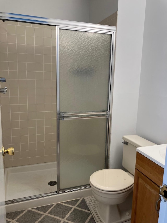 77 Birchwood Rd, Coram, NY 11727 - full bath with vanity, a stall shower, and tile patterned flooring