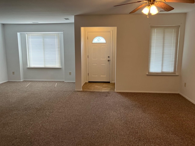 77 Birchwood Rd, Coram, NY 11727 - entrance foyer featuring ceiling fan and light carpet