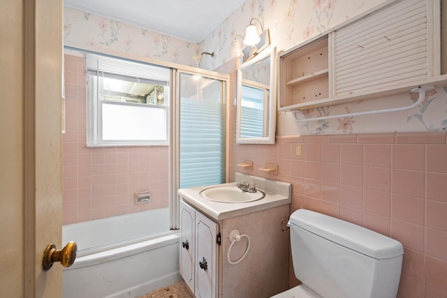 302 Waukena Ave, Oceanside, NY 11572 - bathroom with vanity, shower / bath combination with glass door, wallpapered walls, and tile walls