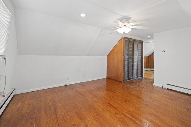 302 Waukena Ave, Oceanside, NY 11572 - additional living space featuring baseboard heating, a ceiling fan, lofted ceiling, hardwood / wood-style flooring, and a baseboard heating unit