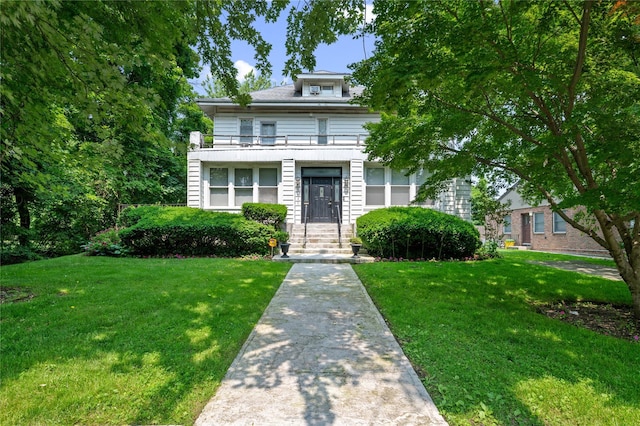 1020 New Mcneil Ave, Lawrence, NY 11559 - view of front of house with a balcony and a front lawn