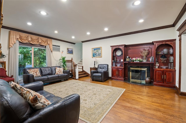 1020 New Mcneil Ave, Lawrence, NY 11559 - living room featuring crown molding, stairway, recessed lighting, light wood-type flooring, and a high end fireplace